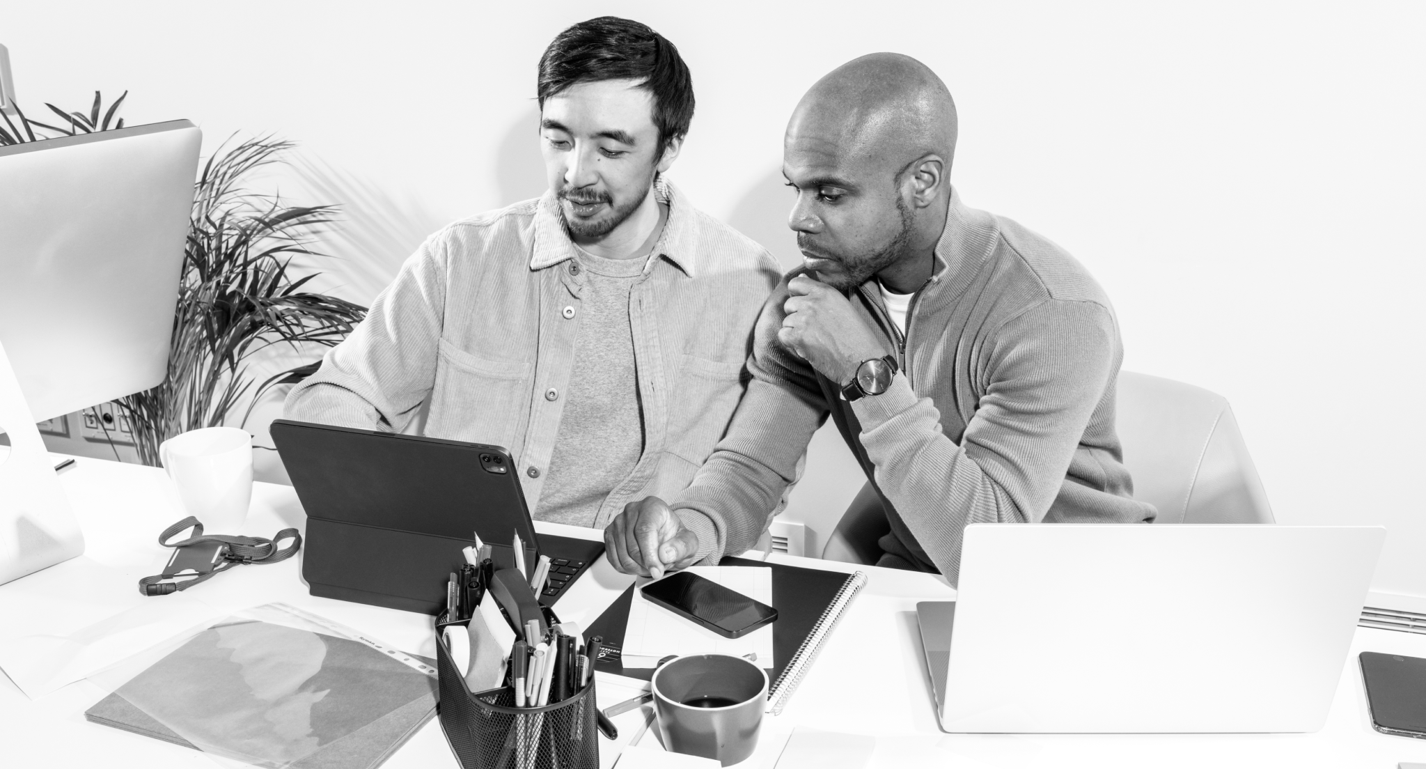 two guys in front of a computer